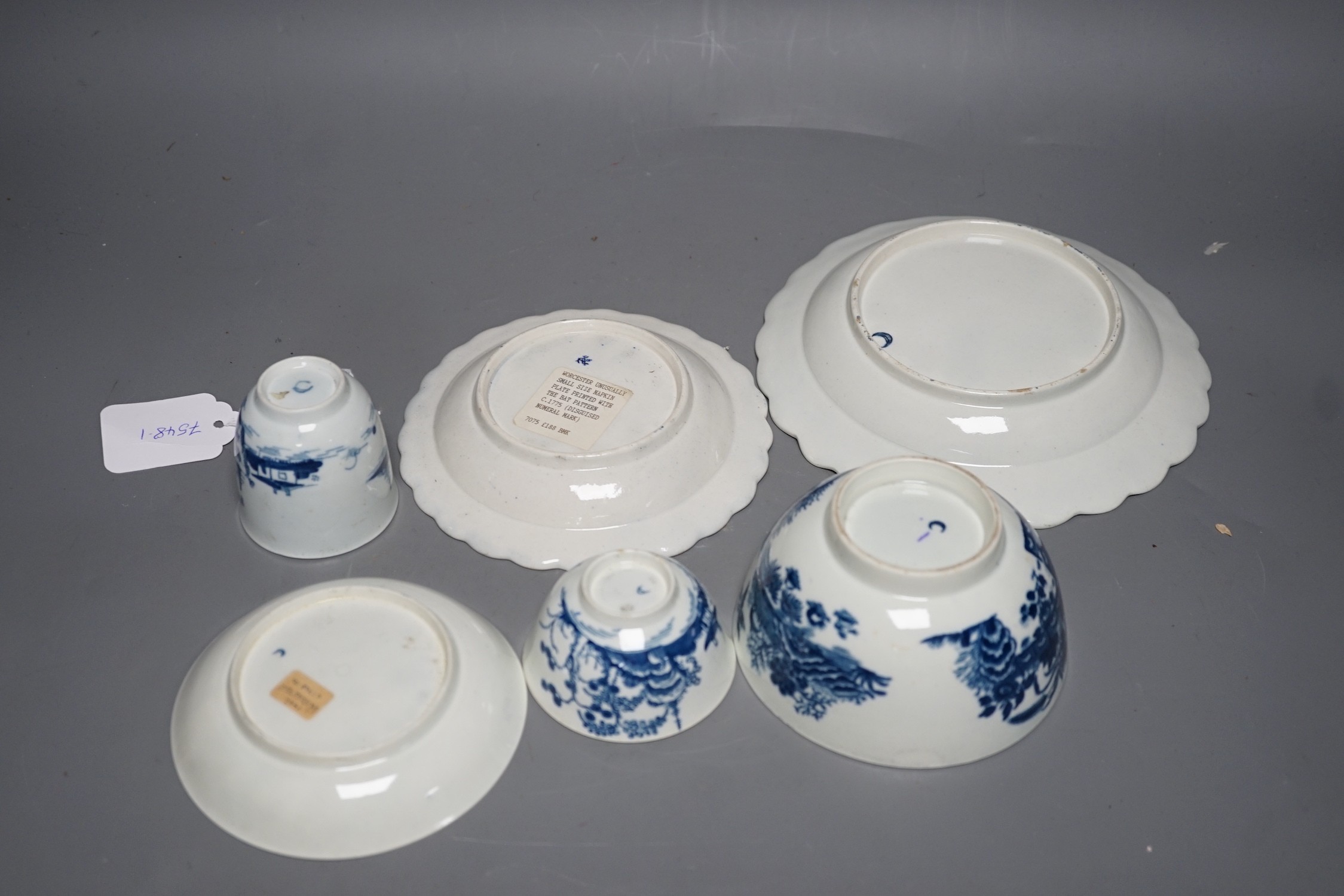 A Worcester teabowl, coffee cup and saucer painted with the Cannonball pattern, a rare napkin plate with the Bat pattern, a medium size Pine Cone plate and a Fence pattern bowl